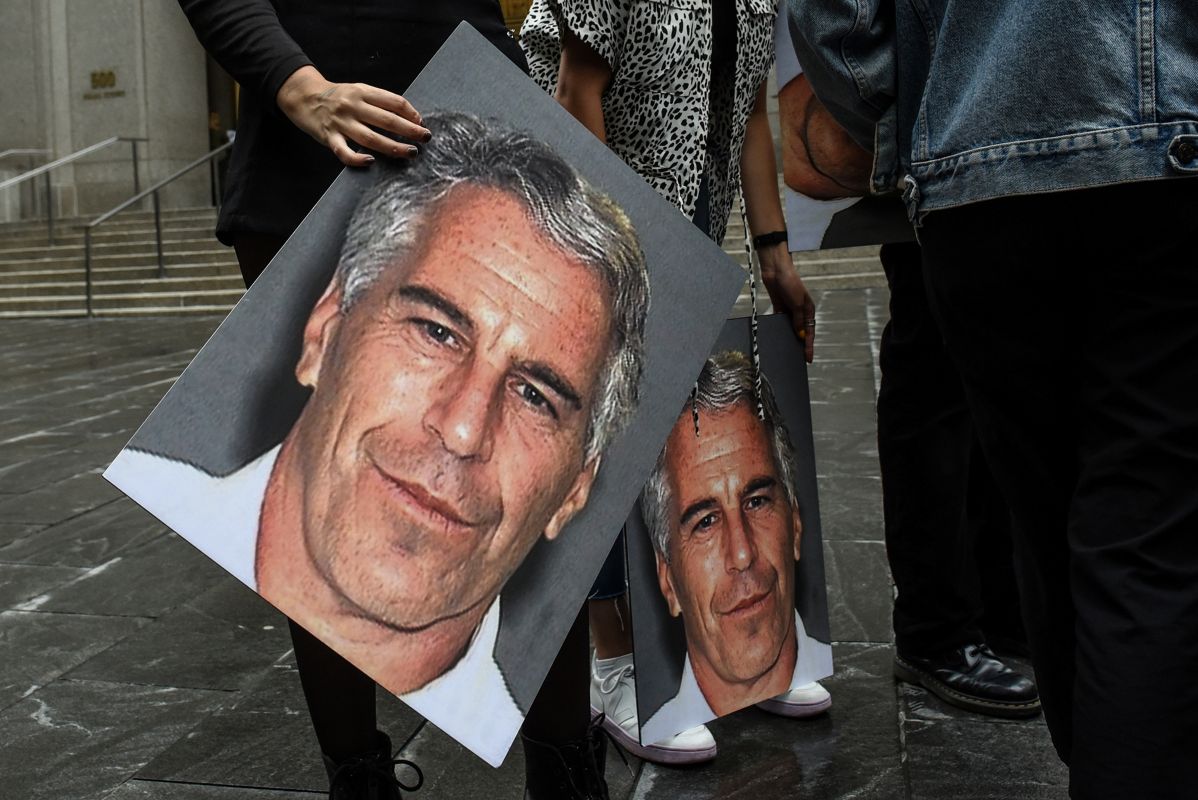 A protester holds an image of Jeffrey Epstein outside the federal courthouse in New York in 2019. Photographer: Stephanie Keith/Getty Images