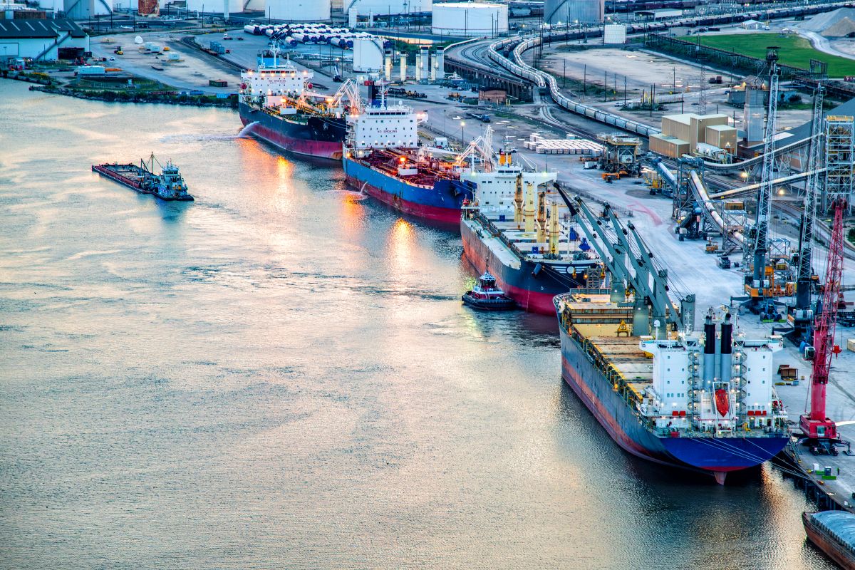 A variety of ships including a large bulk carrier and liquid tanker ships along the Houston Ship Channel about four miles from downtown Houston, Texas. Photo: iStock/Art Wager