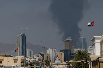 Smoke rises after an explosion in the industrial zone in Fujairah, United Arab Emirates, on Tuesday, March 3, 2026. Oil surged for a second day as the U.S. and Israel stepped up their war against Iran, with a fire at a key storage hub in the United Arab Emirates underscoring the risk to energy supplies. Source: Bloomberg