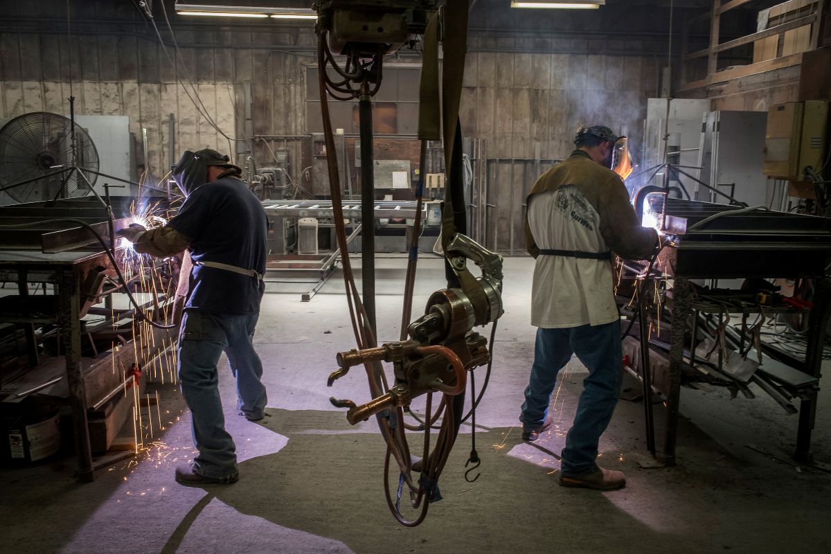 Workers weld seams at a metal manufacturing facility in Sacramento, California. Photographer: David Paul Morris/Bloomberg