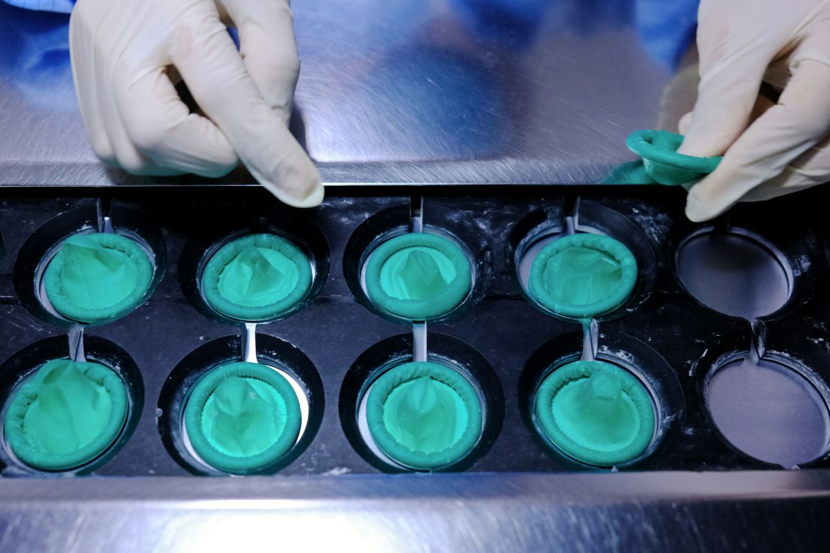 Condoms on the production line at a Karex Bhd. facility in Port Klang, Selangor, Malaysia. Photographer: Samsul Said/Bloomberg