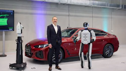 Michael Nikolaides, Head of the BMW Group Production Network and Logistics, with the humanoid robot AEON. Photo: BMW Group