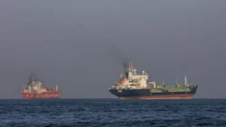 Ships anchored in the Strait of Hormuz near Larak Island, Iran on May 16. Photographer: Majid Saeedi/Getty Images
