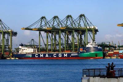 The CMA CGM SA Montmartre container ship leaves the PSA International Pte Ltd. Pasir Panjang Terminal in Singapore in February. Photographer: SeongJoon Cho/Bloomberg