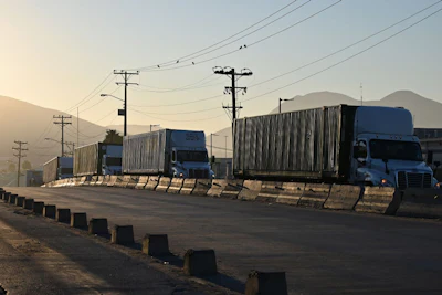 Tractor trailers wait in line at the Otay Mesa Port of Entry, on the U.S.-Mexico border. Photo: Bloomberg