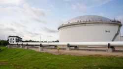 A pipeline runs toward oil Southbow storage tanks at the Cushing crude oil storage terminal in Cushing, Oklahoma. Photographer: Nick Oxford/Bloomberg