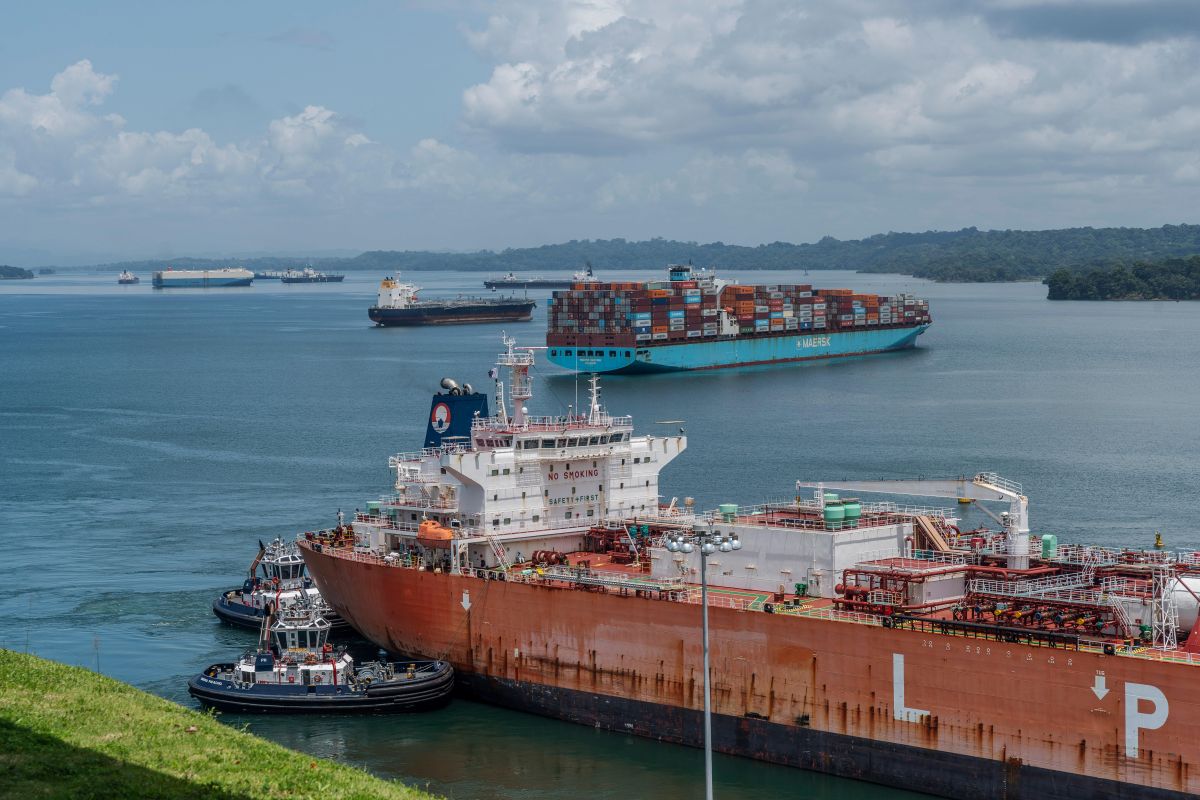 An LPG vessel and a container ship navigate the Agua Clara locks of the Panama Canal near Colon, Panama. Photographer: Walter Hurtado/Bloomberg