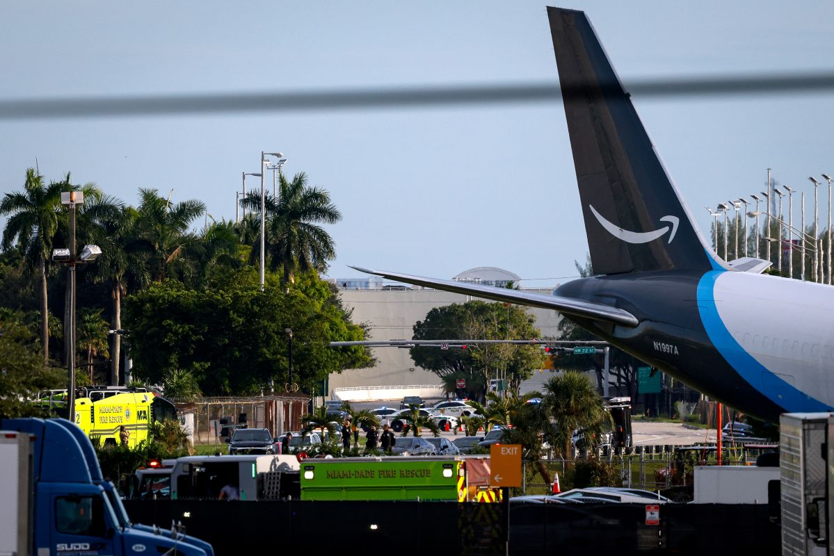 Emergency personnel respond near the site of an Amazon cargo plane crash at Miami International Airport (MIA) in Miami, Florida, US, on Sunday, Sept. 6, 2026. The Boeing 767-300, operated by 21 Air as Prime Air Flight 7598, overshot the runway and burst into flames, killing at least five people and shutting down the airport's runways. Photographer: Eva Marie Uzcategui/Bloomberg