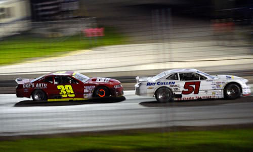 Competitors fly around the track at the recent ISMA race sponsored by Don-Mor CARSTAR Collision.