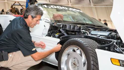 General Motors Global Design Fabrication Operations Director David Bolognino attaches the final panel to complete the restoration the 1-millionth Corvette Thursday, September 3, 2015 at the National Corvette Museum in Bowling Green, Kentucky.