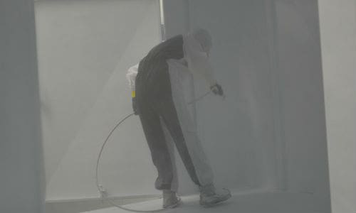 A painter coats the inside of a trailer at Three Star Trucking. The company recently started offering its heavy repair services to other operators.