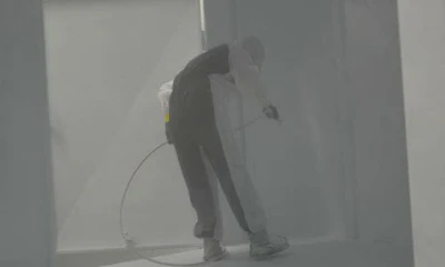 A painter coats the inside of a trailer at Three Star Trucking. The company recently started offering its heavy repair services to other operators.