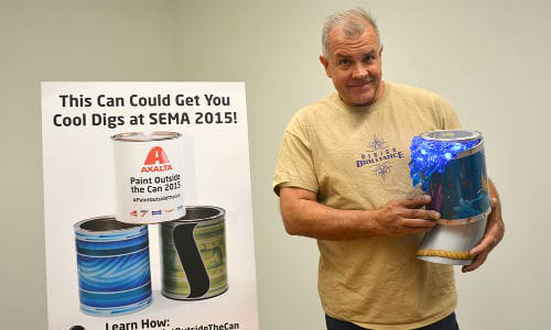 Paul Quinn, renowned airbrush and pinstriping artist and instructor in the custom paint industry, served as one of the celebrity judges Quinn is shown here holding Mike &ldquo;Splash&rdquo; Burton&rsquo;s &ldquo;Paradise Pipeline,&rdquo; which swept the contest by winning in the categories of Fan Favorite and Celebrity Pick, as well as the Grand Prize.