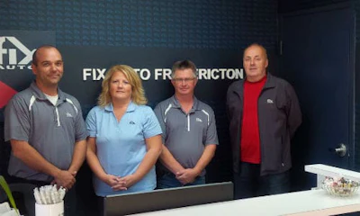 Some of the team from Fix Auto Fredericton. The facility has recently joined the Fix Auto network.
