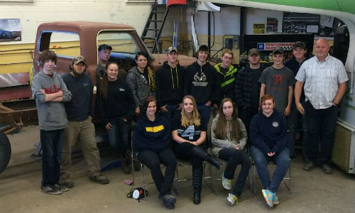 Craig Sindall of Napanee District Secondary School and the students in the Colourshop Focus program he's running this semester. Students spend full days in the shop during the program, giving them the opportunity to do large projects, such as restoring a '69 F-250 (seen here). Students are registered as Specialist High Skills Majors, which gets them extra training and a Red Seal on their Grade 12 diplomas.