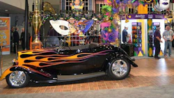 Bobby Alloway won the 2015 Battle of the Builders with this 1933 Ford Roadster, seen here on display at PPG's Mardi Gras themed booth at the SEMA Show.
