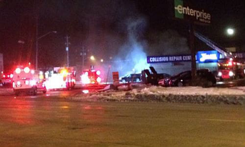 Fire crews battle the blaze in Winnipeg. No injuries were reported, but witnesses say as many as 40 cars may have been inside the building.