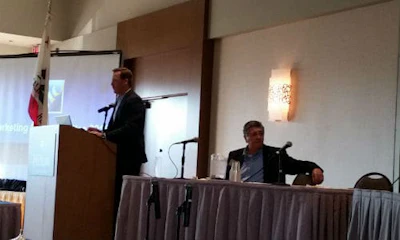 Chris Brandl (standing) and Guy Barness are committee leaders with CIC. Brandl says CIC should depart from 'granular topics' and discuss challenges likely to cause industry disruptions. Photo by John Huetter/Repairer Driven News.