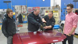 Errol Cowan of Titanium Tools & Equipment (centre) demos the Miracle System for some of the staff at CSN-Carlaw Collision.