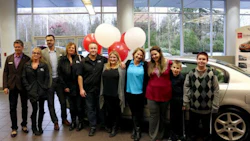 Noelani Dreger, her sons Gaberial and William, and some of the team from Fix Auto Abbotsford who helped get Dreger into a refurbished Nissan Altima in time for the holidays.