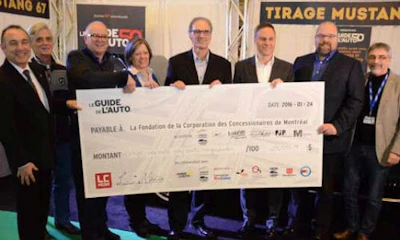 The donation. From left: Serge Gauthier, Luc Langlois, Roger Goudreau, Rachel Leduc, Luc Champagne, Jean Lemieux, Denis Dessureault and Alain Morin. Photo by Guy O’Bomsawin.
