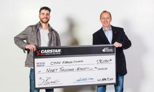 Calgary Flames Defenceman TJ Brodie and Mike Piper, CARSTAR Canada Western Region Director.