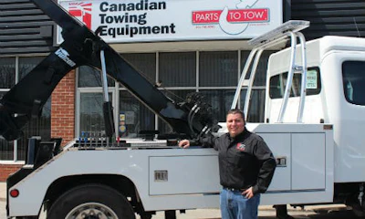 A staff member demonstrates a truck's features at the open house event. Check out the gallery below for more photos!