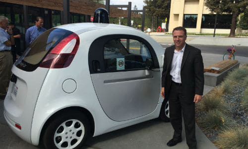 Mark Francis of ICBC with one of Google's self-driving cars. Francis believes insurance premiums will likely decrease as a result of AVs.
