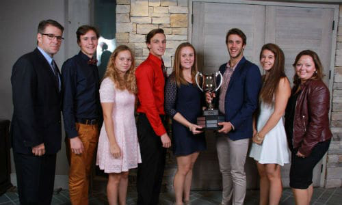Michel Charbonneau, Uni-Select&rsquo;s Vice-President of Sales and Marketing, PBE Division and responsible for the Carrossier ProColor business unit (left) with some of the scholarship recipients from the 2015 event.