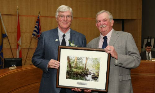 Bernhard Rubbert of False Creek Collision accepts the award from Derek Corrigan, Mayor of Burnaby.
