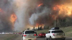 Large flames and heavy smoke surrounded a congested Highway 63 South as residents evacuated from Fort McMurray in early May. Fix Auto franchisees and staff across Canada have stepped up to donate to the Red Cross' Alberta Fires Appeal.