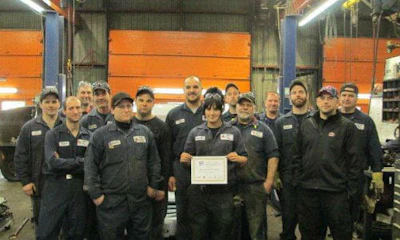 The team at LKQ Lecavalier in Ste-Sophie, Quebec with their Golden Switch Award. The award celebrates five consecutive years of active participation in the Switch Out program.