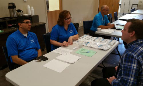 Representatives of CSN-427 Auto Collision interviewing a prospective employee at the Pre-apprenticeship Career Fair in 2015. A number of employers have already signed up for this year's event, but booth space is still available.