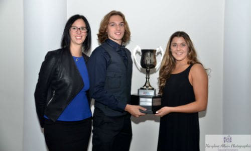 Melissa Murphy of Carrossier ProColor (left) presents the Carrossier ProColor trophy to Daphn&eacute; Demers and Antoine Ch&acirc;telain-Laflamme, first place swimmers in the Coupe Espoir Canada circuit.