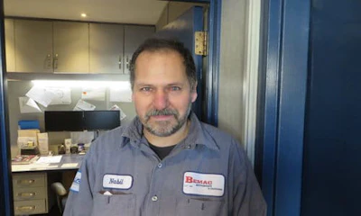 Nabil Ab-Dabei, a refugee from Syria, has recently found work at CSN-Bemac Auto Body.