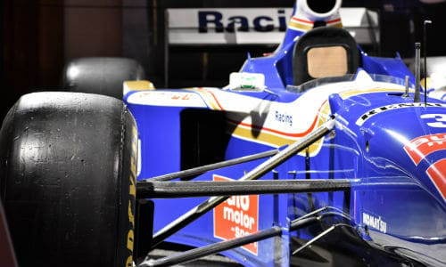 Villeneuve&rsquo;s 1997 Williams FW19 on display at the AutoShow. The car still bears the tire mark from where another driver tried to run him off the track.