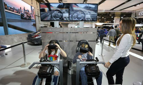 Young AutoShow attendees experience virtual reality (VR) racing at the Lexus display. VR seems to be a large part of this year's offering.