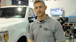 Aaron L. Aldrich of Any Level Lift demonstrates operating the system with the Ride Controller cell phone app at the 2016 SEMA Show. Any Level Lift was the winner of the 2016 SEMA Launch Pad competition.