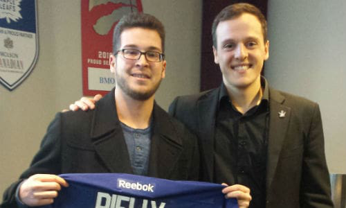 Alex Mandarino (left) holds the signed jersey he received after a night at a Leafs&rsquo; game with Daniel Di Carlo. Mandarino is a young cancer survivor. He and his parents took in the game courtesy of tickets donated by Joe Di Carlo of CSN-J&J Dominion Collision.
