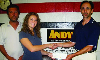 Rob Heslop from Andy&rsquo;s Auto Wreckers with his daughter Lindsay, receiving her OARA scholarship cheque from Steve Fletcher of OARA. Heslop&rsquo;s daughter Lauren received an OARA Scholarship this year, being the fourth of his children to do so.