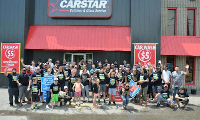 Volunteers at CARSTAR Brampton during CARSTAR's annual Soaps It Up carwash. CARSTAR and partners across the country come together every year to raise funds for Cystic Fibrosis Canada.