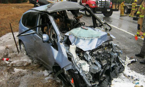 John Eagle Collision Center has been accused of using glue to repair the roof of the Honda Fit shown here, as opposed to welds, as called for by Honda&rsquo;s repair procedures. Both of the vehicle occupants sustained injuries in the crash.