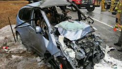 John Eagle Collision Center has been accused of using glue to repair the roof of the Honda Fit shown here, as opposed to welds, as called for by Honda’s repair procedures. Both of the vehicle occupants sustained injuries in the crash.