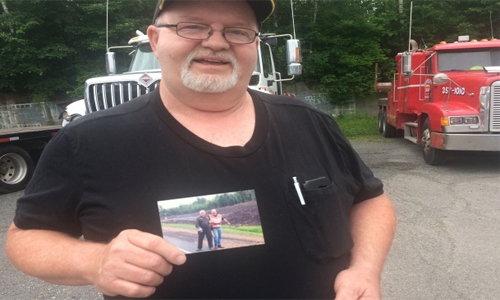 LLoyd Munn, a retired tow truck operator holds up a photo of himself and Bob Dewitt. Last month, after a long fight with Leukemia, Bob Dewitt passed away. Owner of Bob&rsquo;s towing, Dewitt had made a name for himself in the Fredericton towing community. A much loved friend and a coach, Dewitt spent many years of his life teaching and grooming other operators.