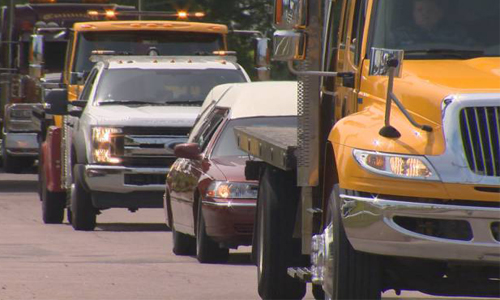 A convoy of tow trucks drove along Sussex New Brunswick to celebrate the life of, and say goodbye to Ralph Douthwright.