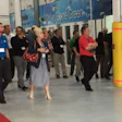 Members of the Coyote Group tour Budds' Collision in Oakville, Ontario. The facility received the Coyote Group Shop of the Year award at the previous meeting in Palm Springs.