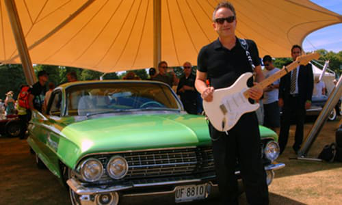Jimmy Vaughan standing beside his &rsquo;61 Cadillac Coupe De Ville. He will be one of the stars featured at SEMA&rsquo;s Industry Awards Banquet this November.