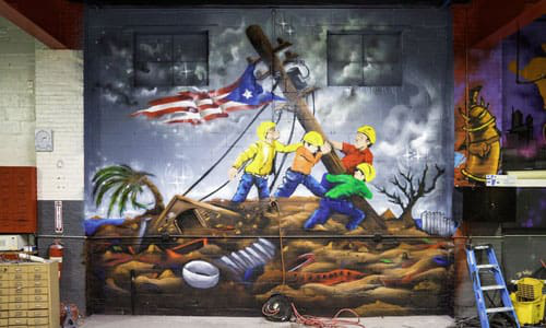 Mike Vargas, the owner of East Coast Customs Automotive Playground, had a huge mural dedicated to the clean-up of Puerto Rico after Hurricane Maria painted on one of the walls.