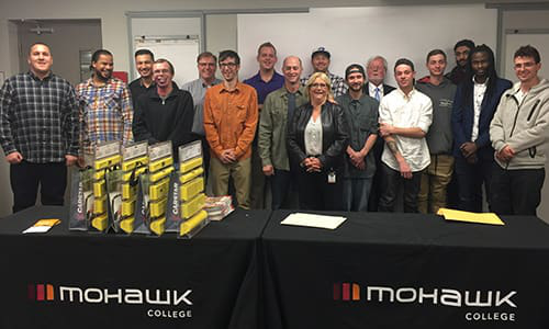 The 15 students who successfully graduated from Mohawk College&rsquo;s Auto Body Collision and Damage Repairer program.