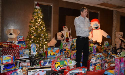 The annual Christmas party gathered more than 200 toys for the charity, as well as the $1,000 dollars raised from its silent auction.